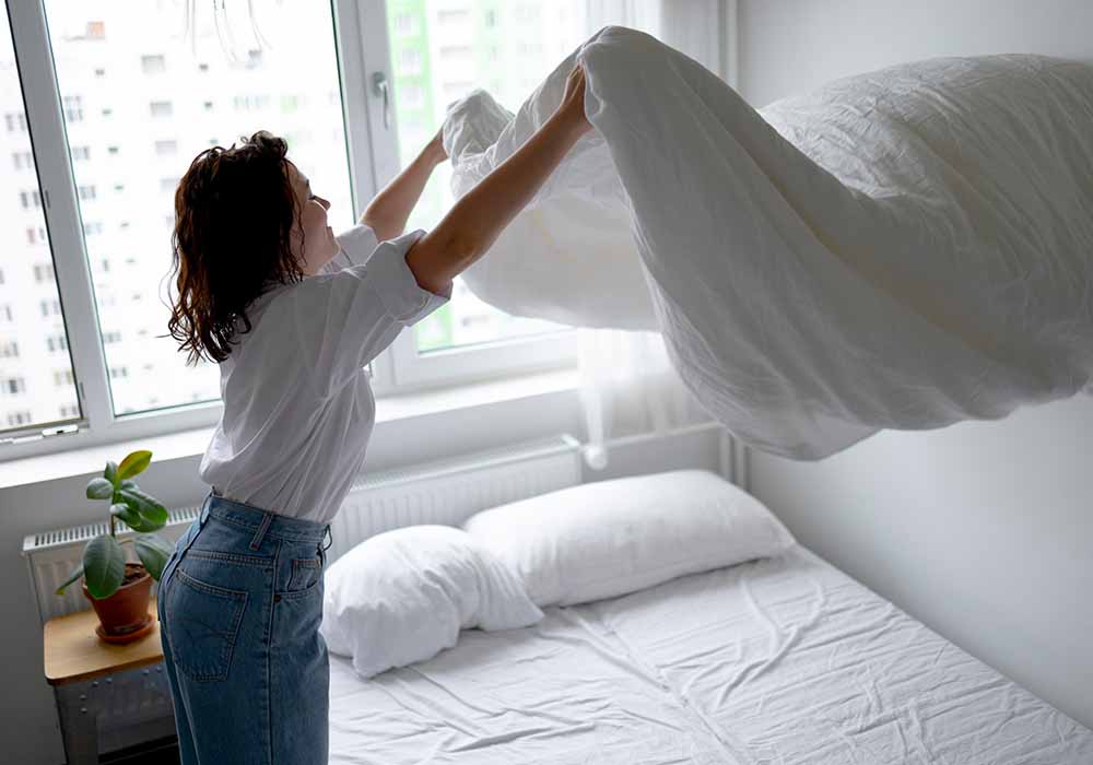 House Cleaning Tips - mom making her bed